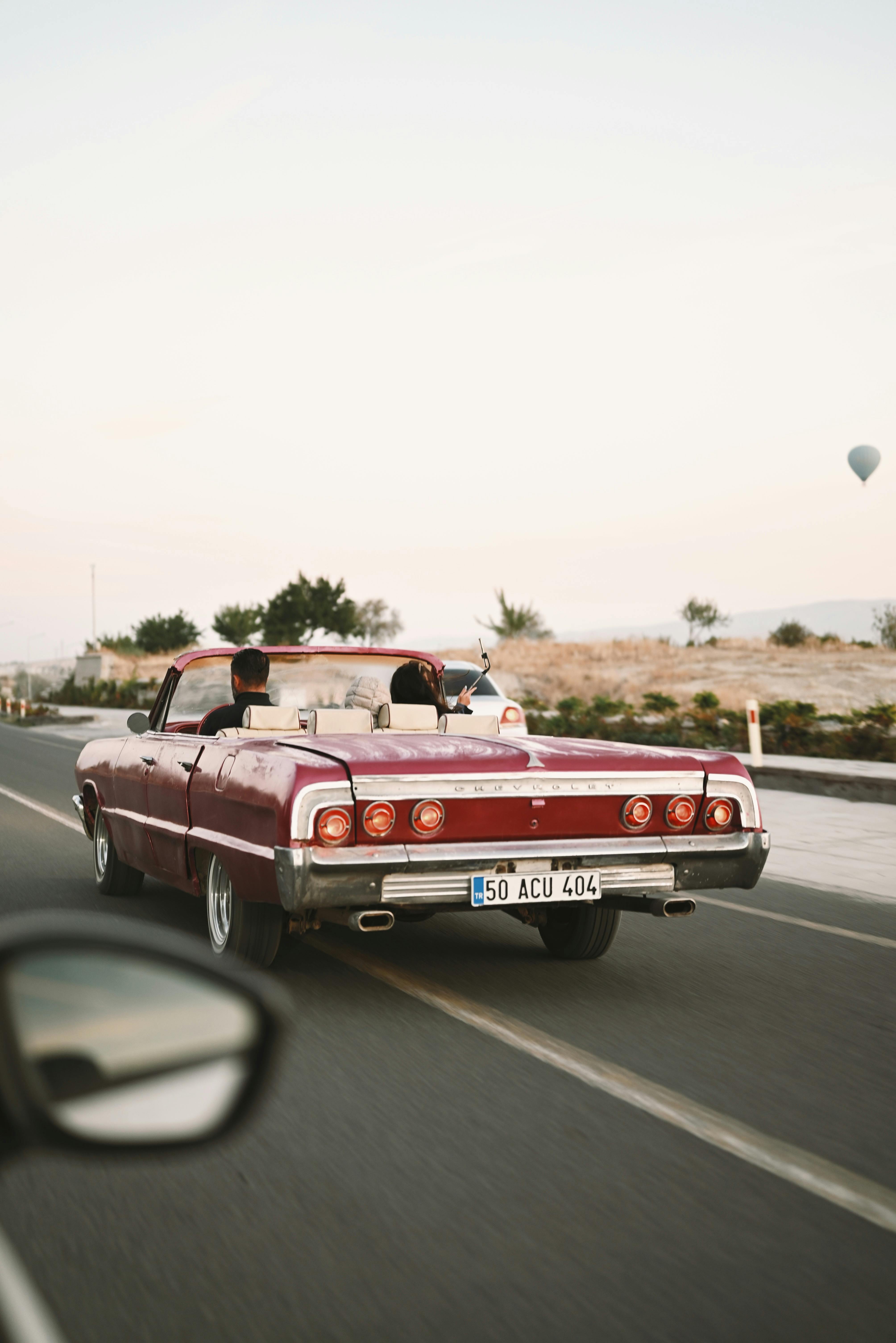 retro car driving on road