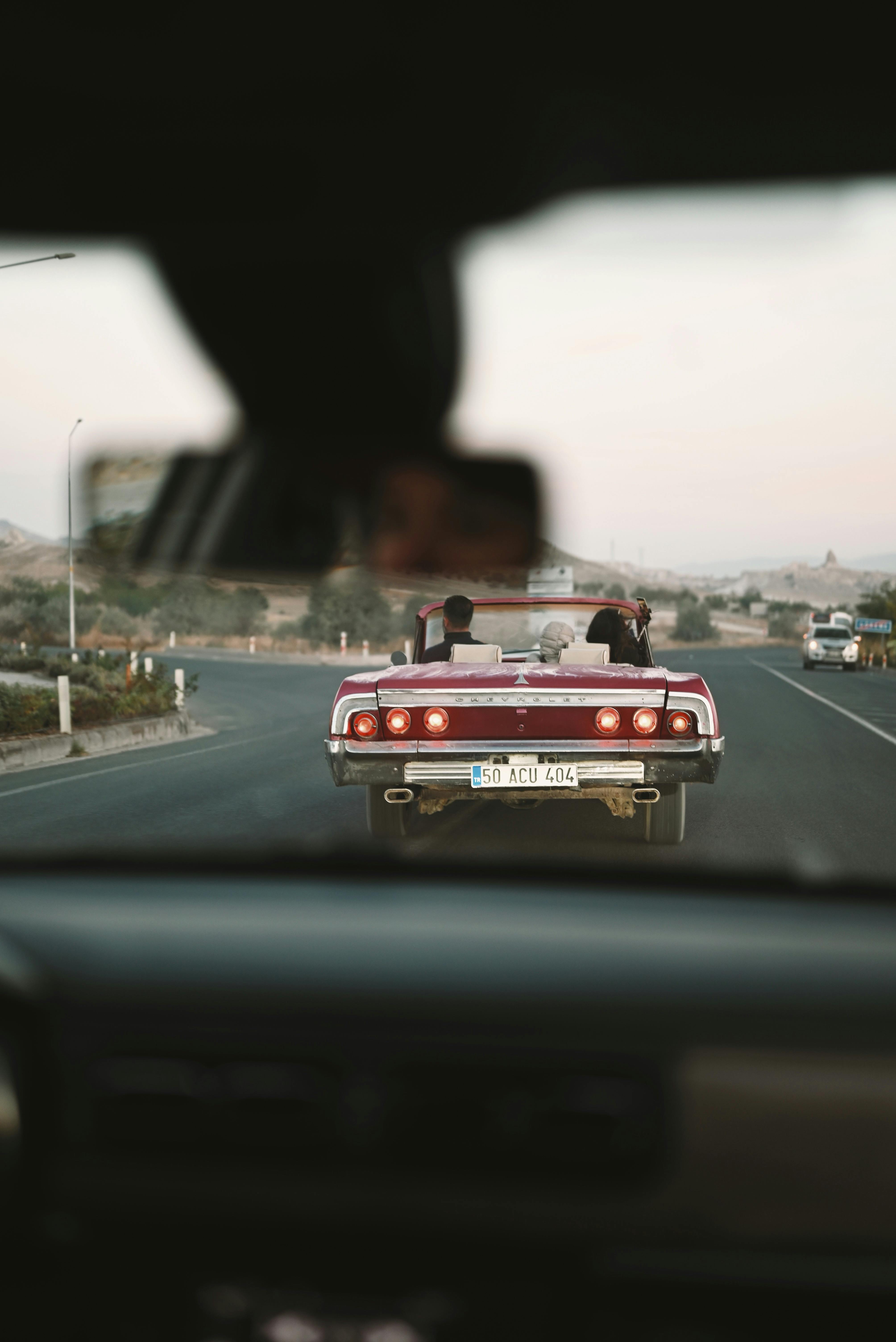 view from windshield on retro car on road