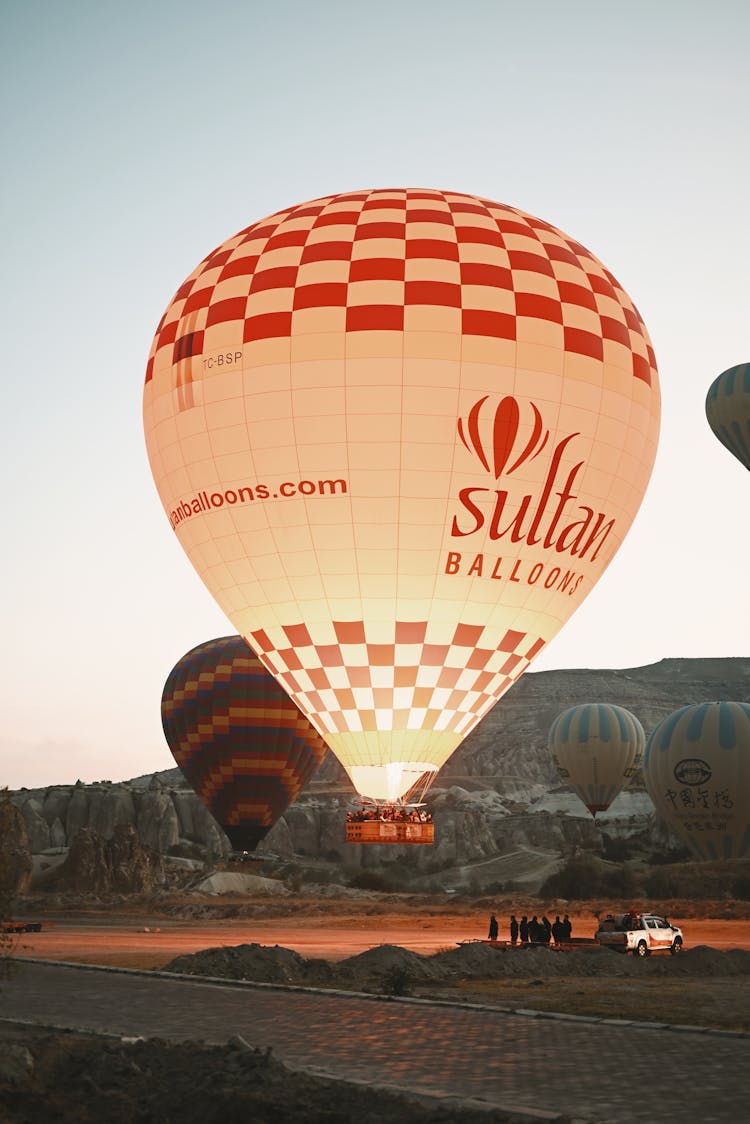 Hot Air Balloons In Mountain Landscape