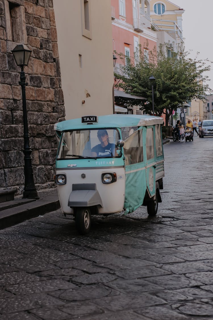 Taxi Driving Down The Street