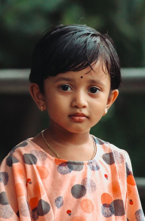 Free Adorable portrait of a young South Asian girl with traditional attire in India. Stock Photo