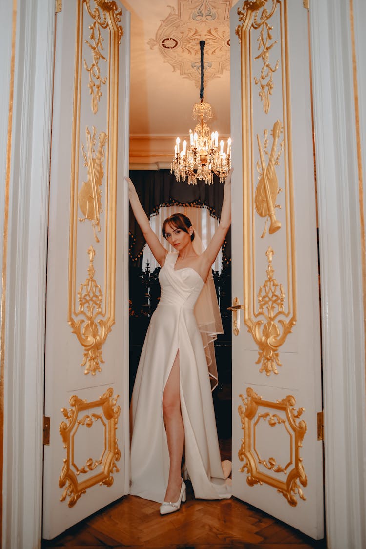 A Bride Holding The Double Doors