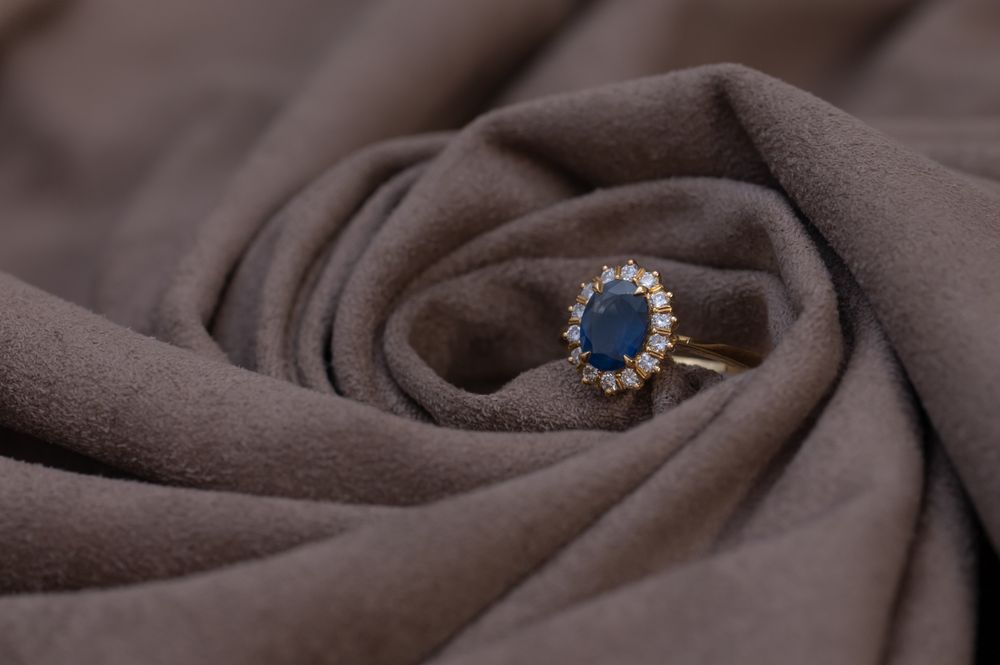 Gold ring with sapphire and diamond stones, close up
