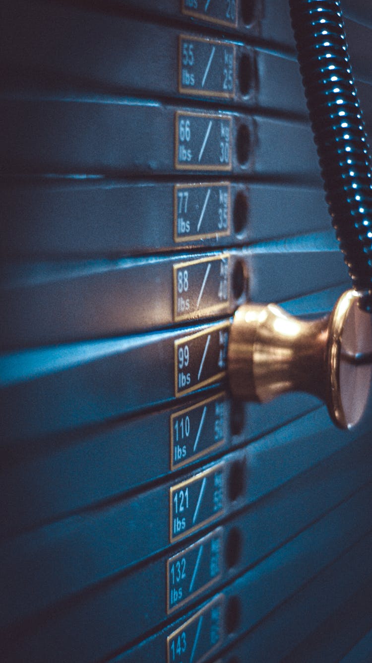 Close-up Of Weights In An Exercise Machine At The Gym 