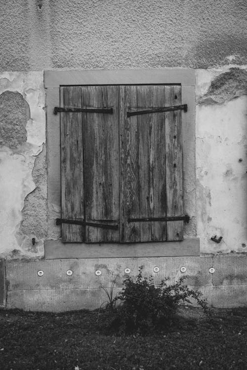 Grayscale Photo of a Wooden Window