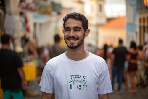 Smiling Man Wearing a White Shirt