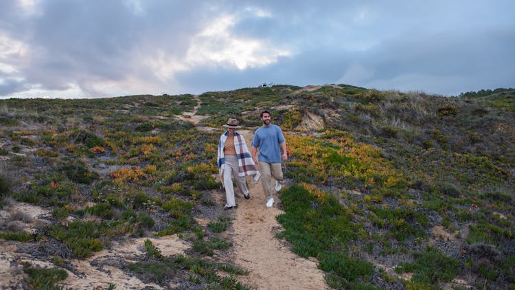 Man And Woman Walking On A Path