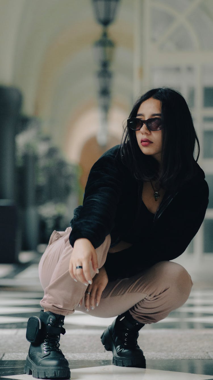 Fashionable Young Woman Wearing Sunglasses And Boots 