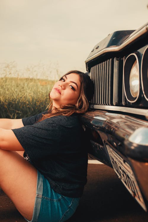 Woman Posing near Car Bumper