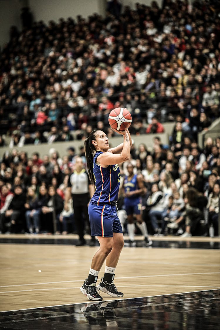 A Woman Shooting A Ball