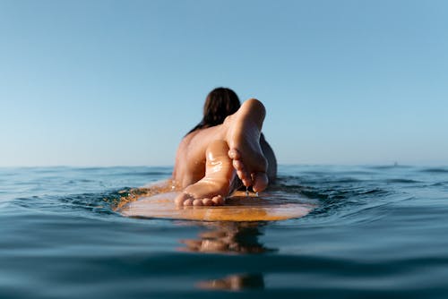 Woman Sailing on a Board