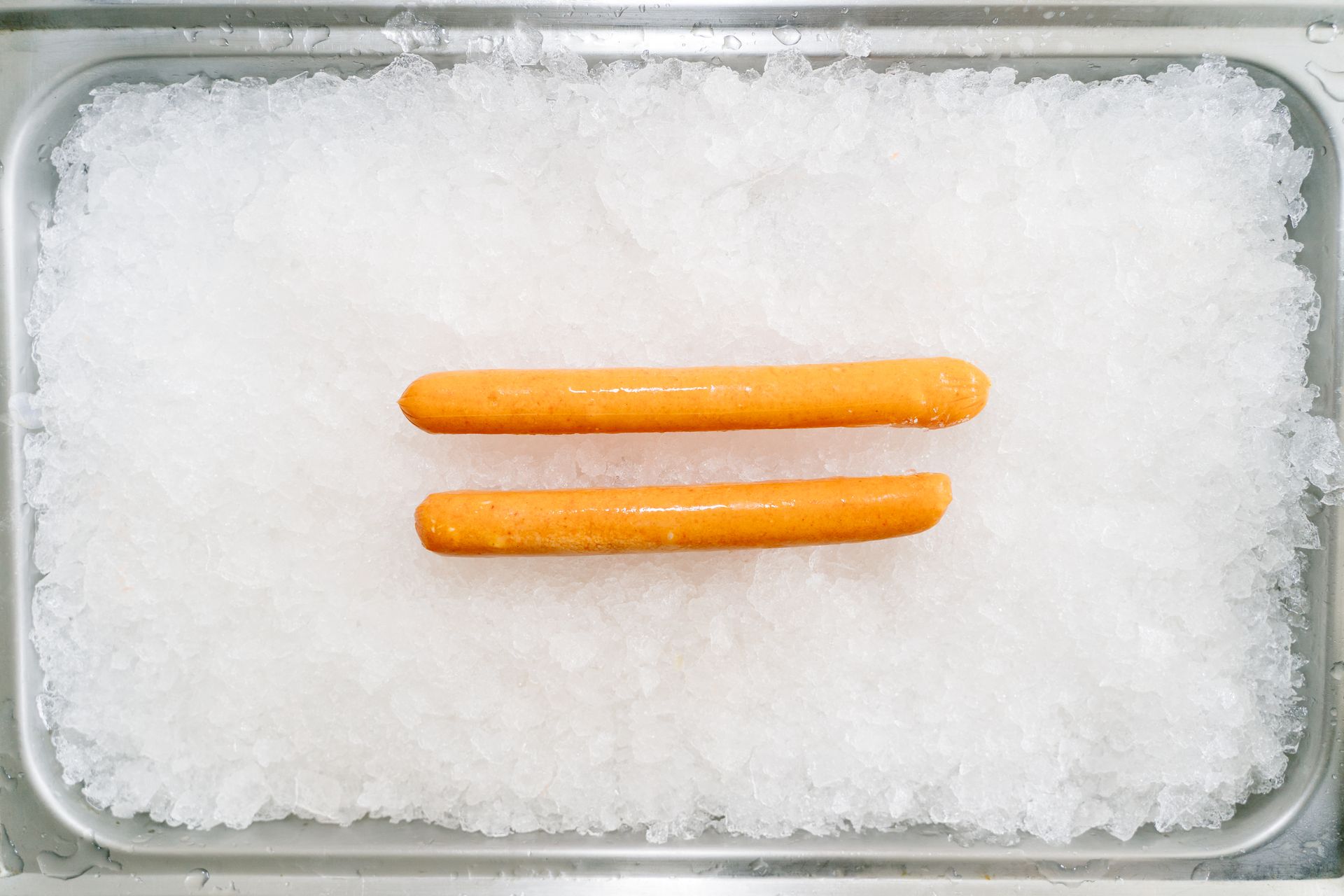 Hot Dog Sausages on a Tray with Ice