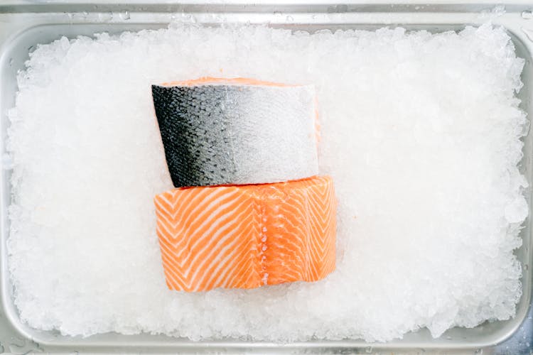 Sliced Salmon On Top Of Ice