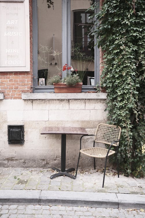 Table and Chair Beside a Window