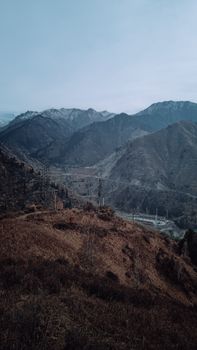 Stunning view of the mountainous landscape in Almaty, Kazakhstan under a clear sky.