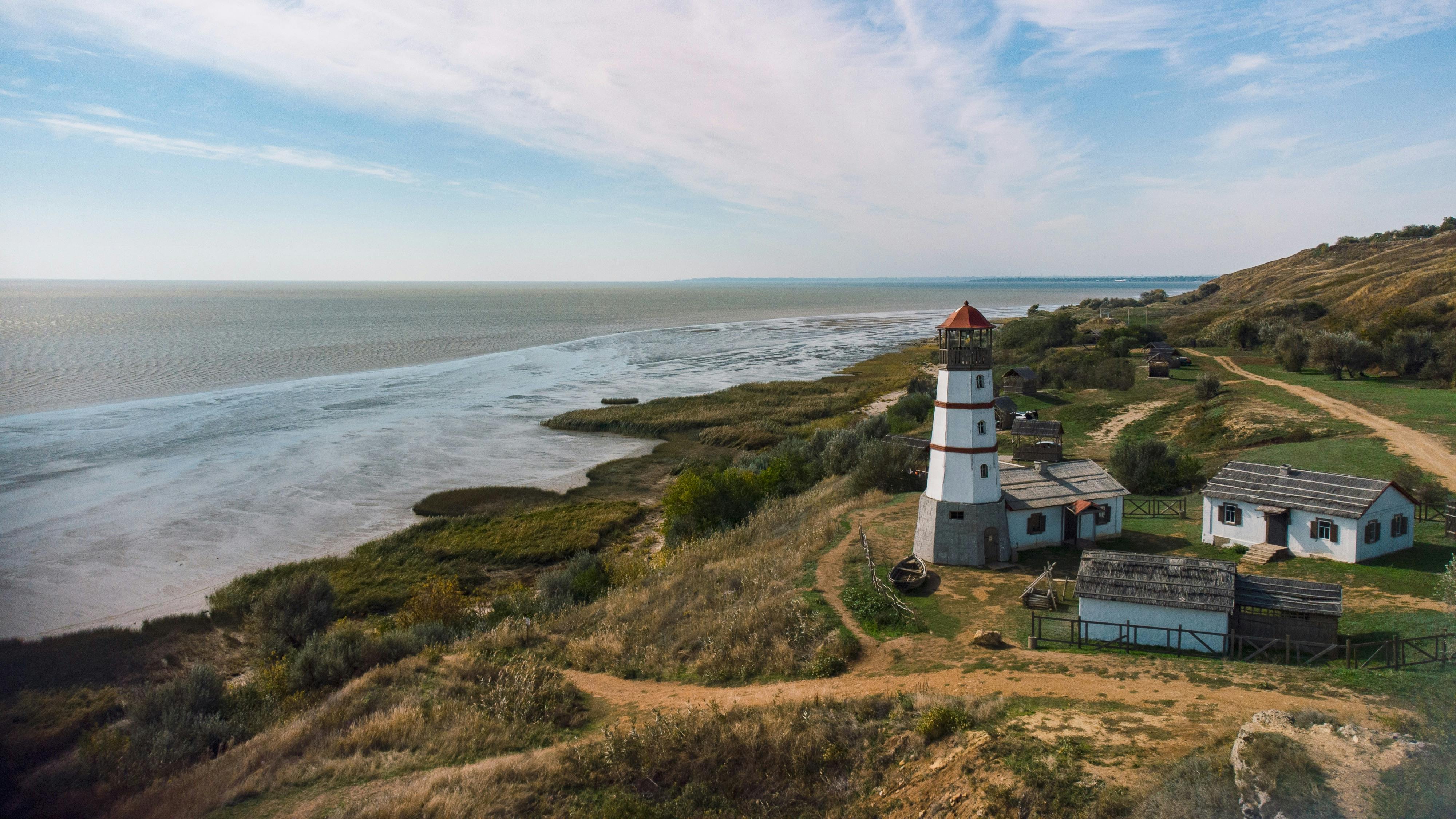 Charming lighthouse at Merzhanovo, Russia, overlooking the Sea of Azov on a clear day.