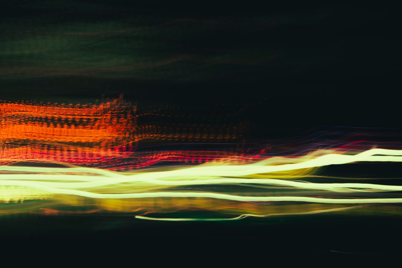 colorful long exposure light trails create an abstract dynamic night s