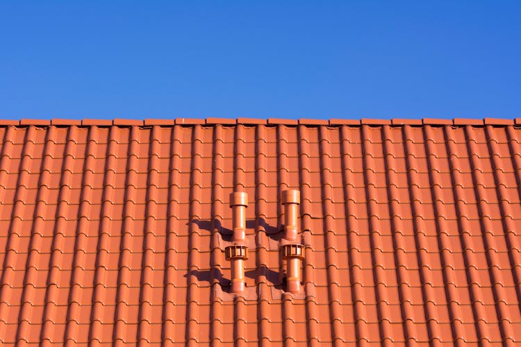 Red Rooftop Under Blue Sky