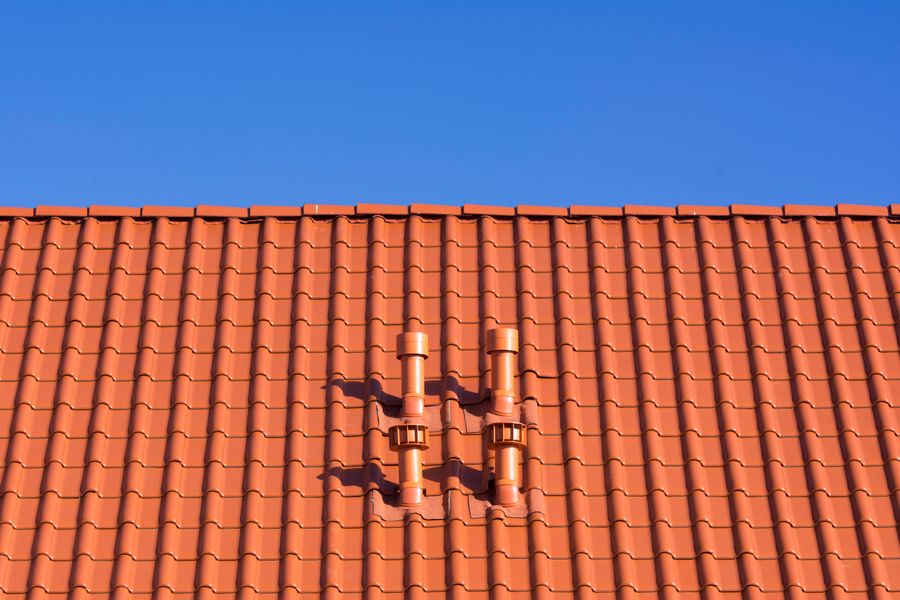 Red rooftop under blue sky
