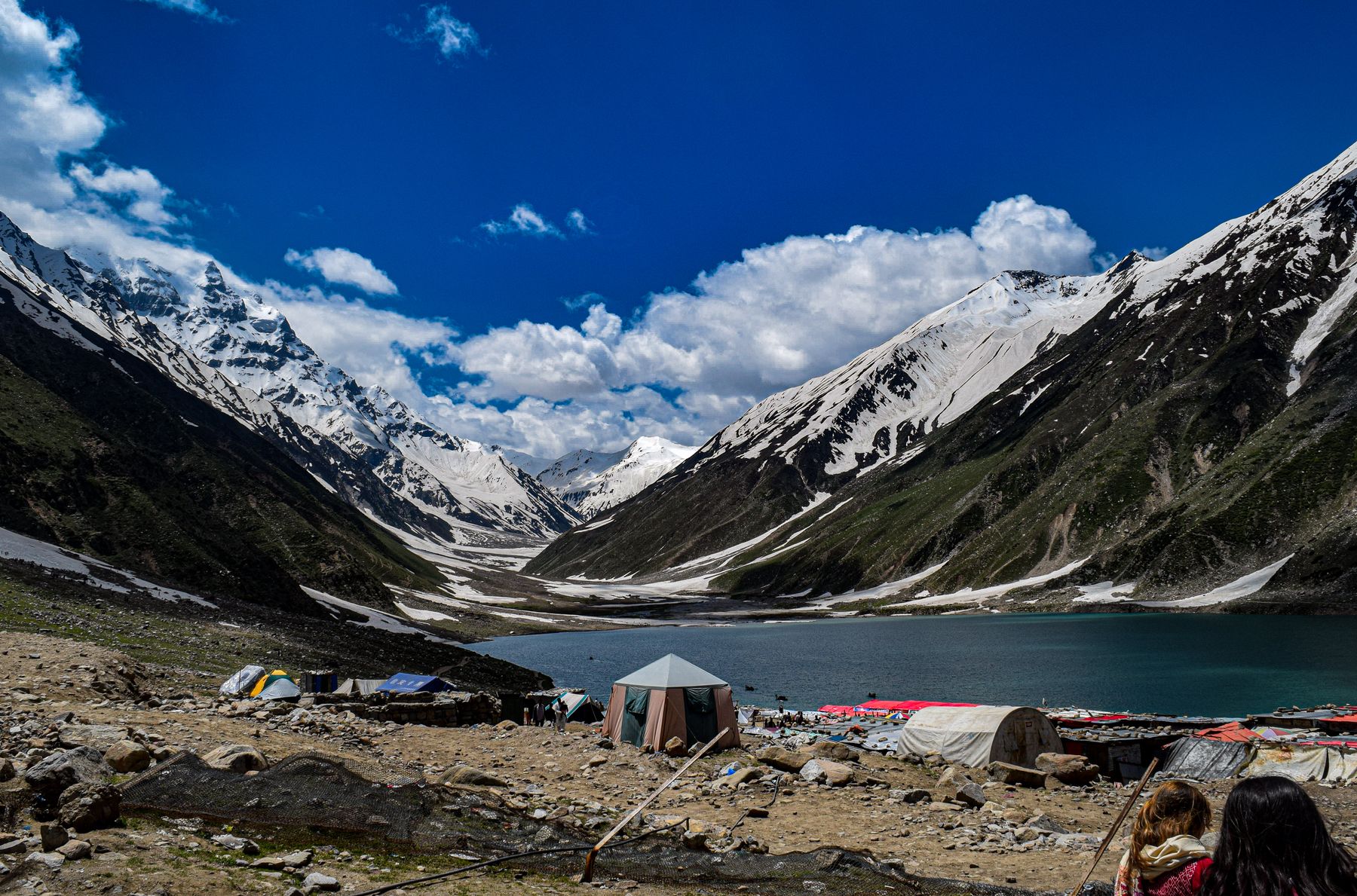 A picturesque campsite by Saiful Muluk Lake, nestled in the majestic Naran Valley, Pakistan.