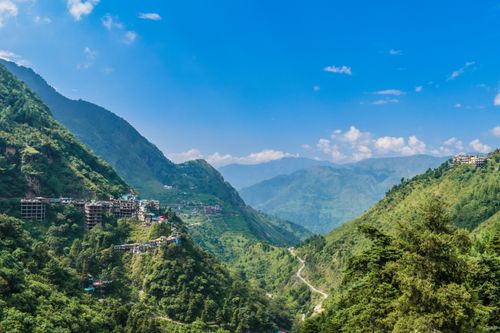 Free Breathtaking aerial view of lush green mountains and village in Rishikesh, India. Stock Photo