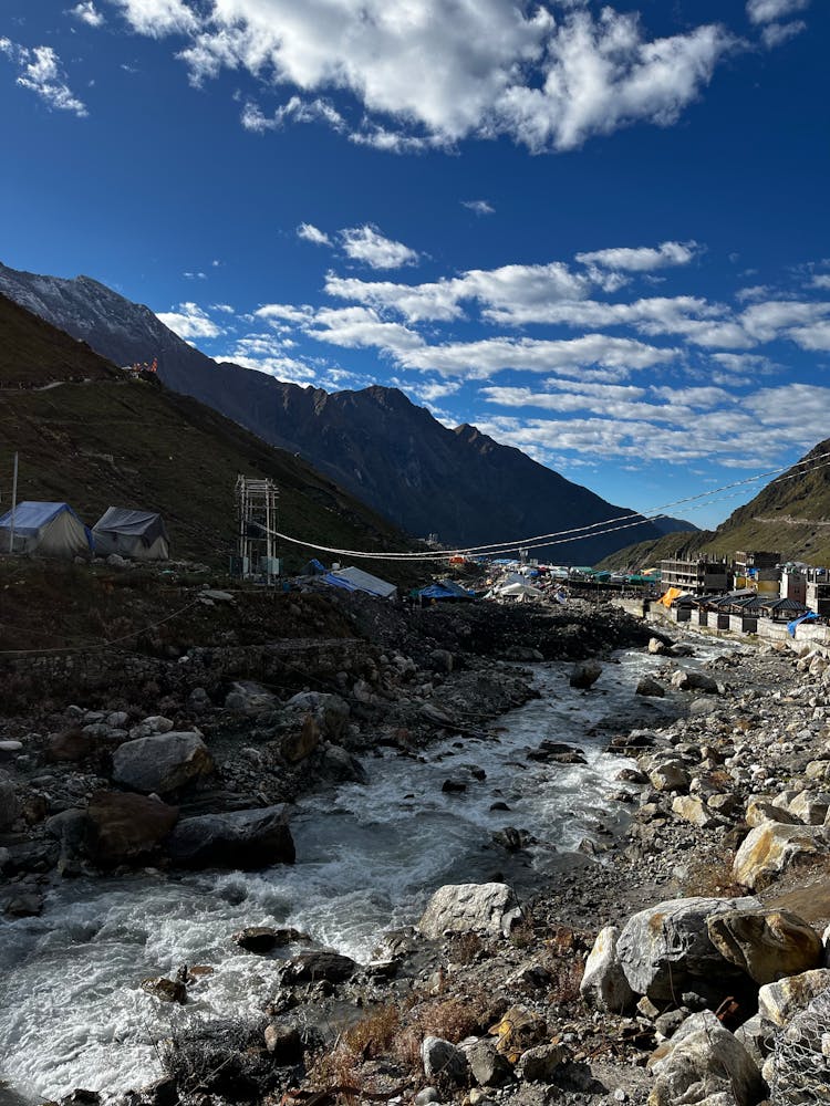 Stream Flowing On Rocks In Mountains Landscape