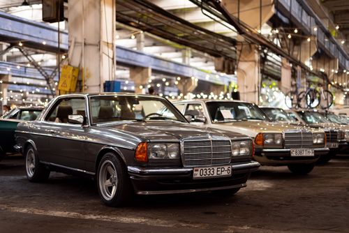 Free Classic Mercedes-Benz cars lined up at an indoor exhibition in Minsk, Belarus. Stock Photo