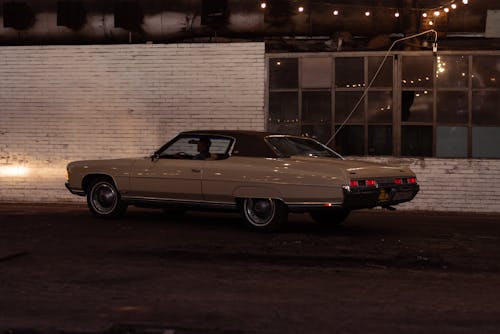 A Man Driving a Classic Car