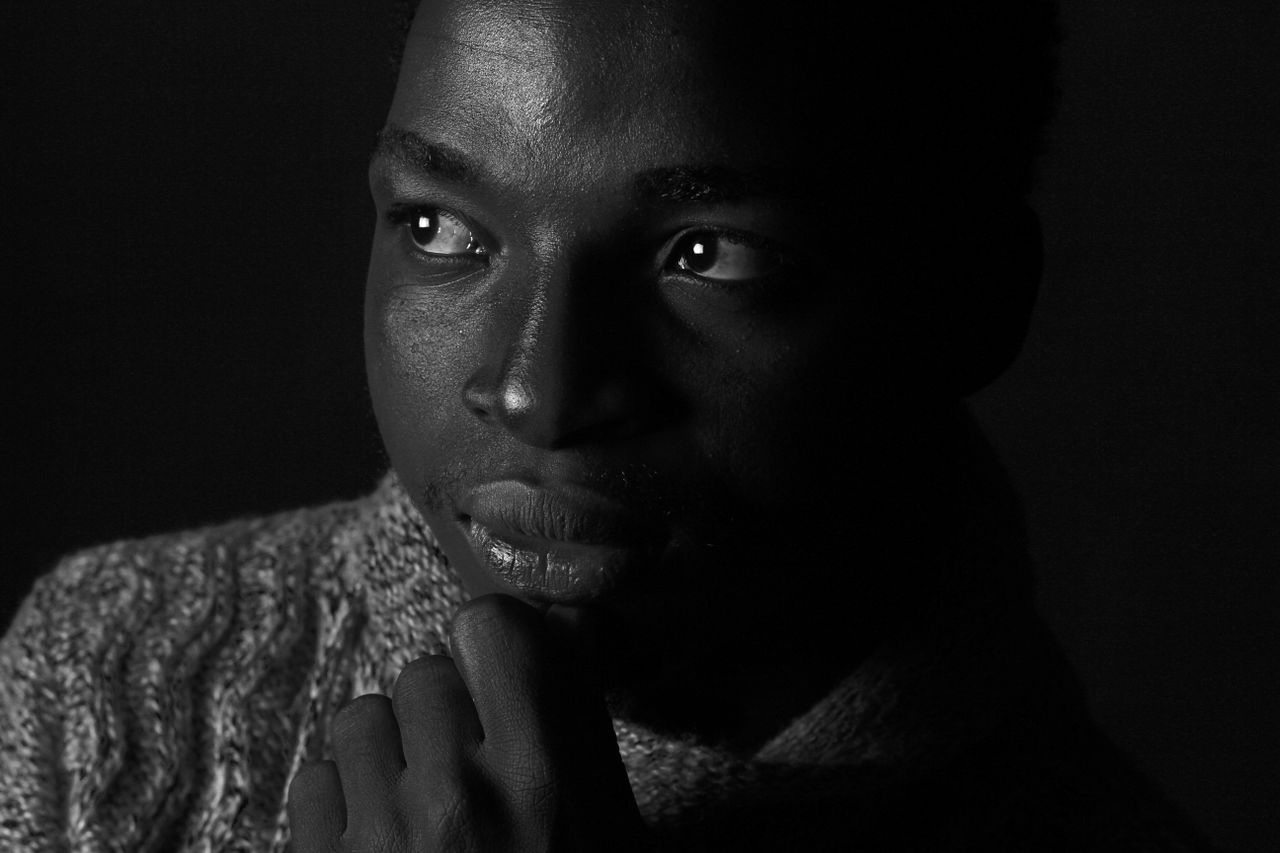 black and white portrait of a man in deep thought capturing contemplat