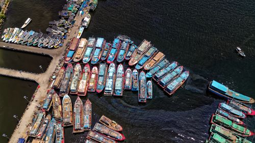 Free A vibrant aerial view of fishing boats docked at Penjaringan, Jakarta, Indonesia. Stock Photo