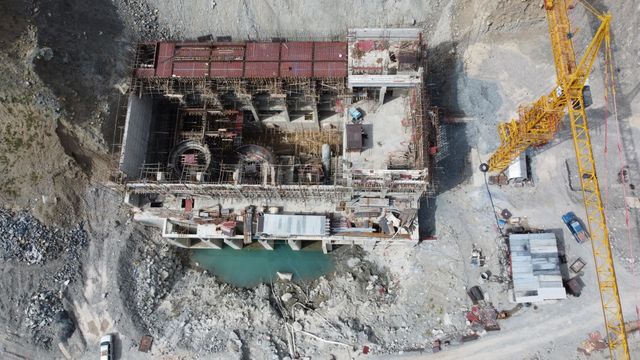 Aerial drone shot of a construction site with a crane