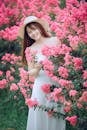 Woman Behind Pink Flowers