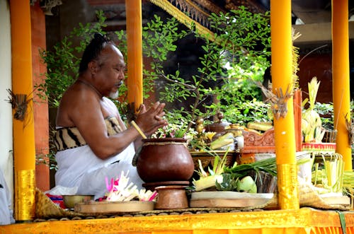 Balinese hinduism priest is delivering a sacred ceremony in golden stage