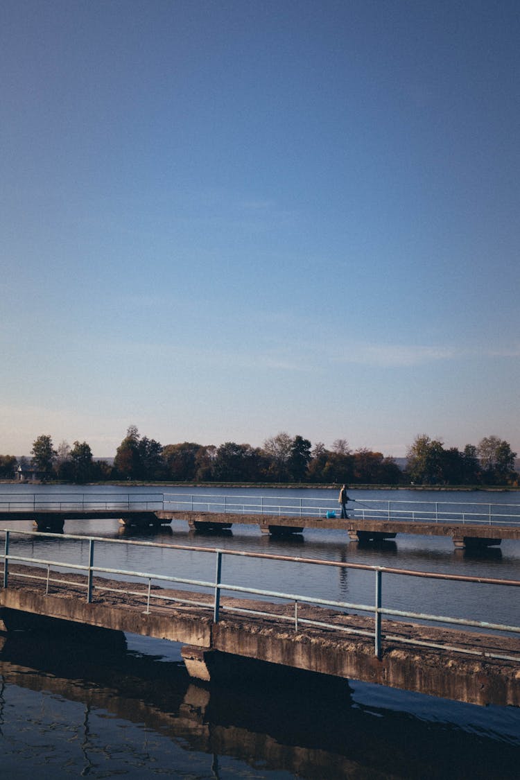 A Person Fishing On Dock