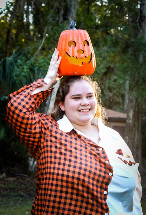 A Woman with a Jack-o'-Lantern Over Her Head