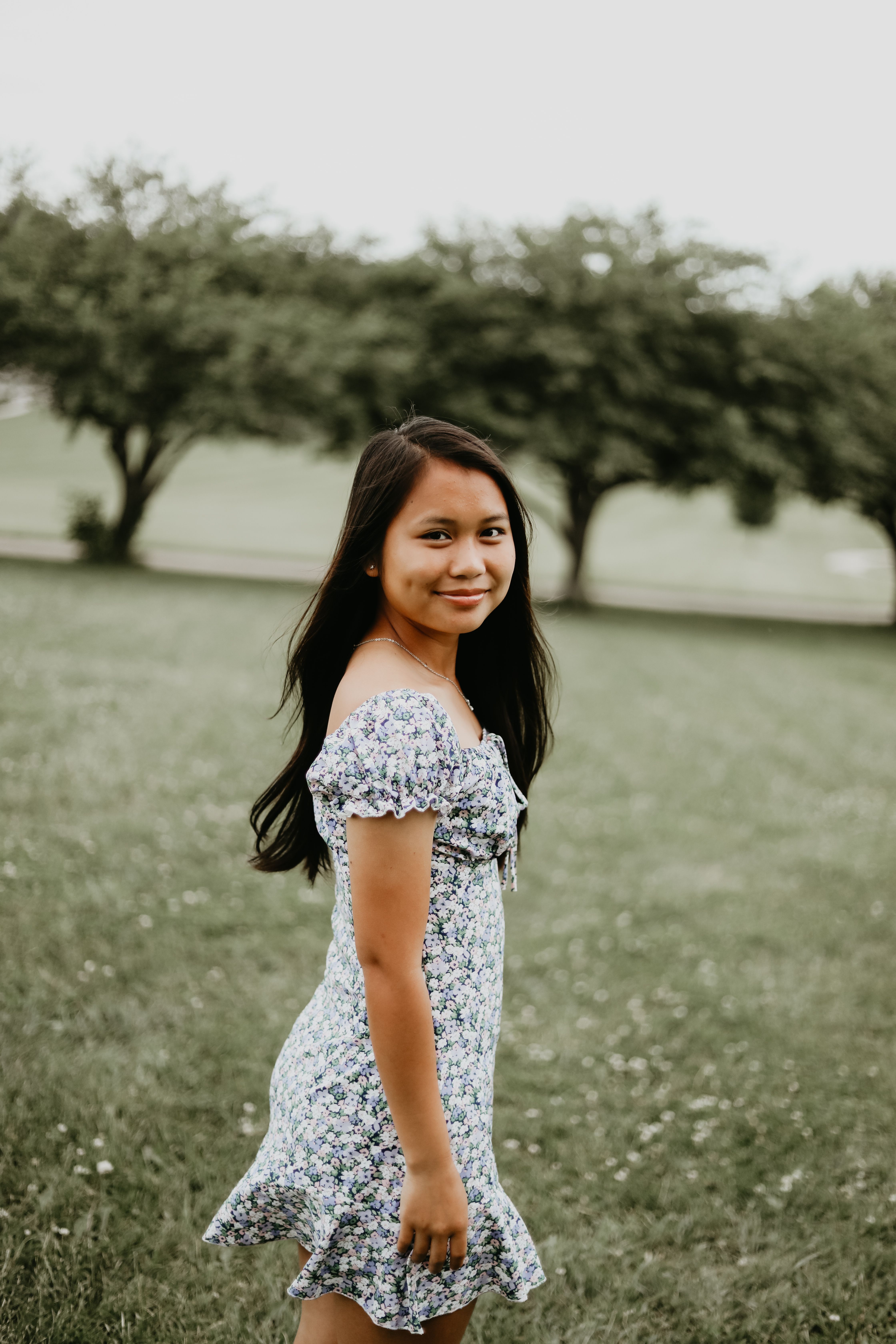 Photo of a Woman Wearing Floral Dress in the Field · Free Stock Photo