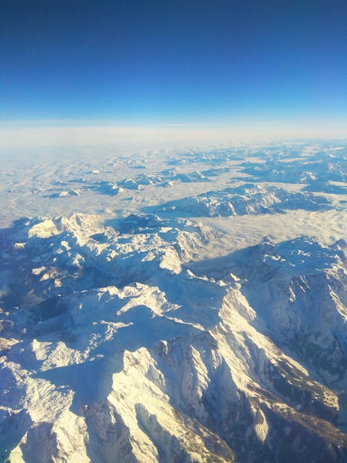 Free Aerial View of Snow-covered Mountains Stock Photo