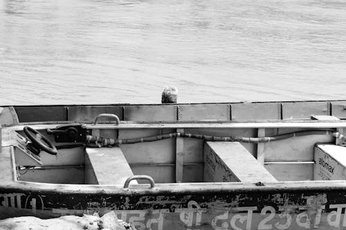 Grayscale Photo of an Empty Boat