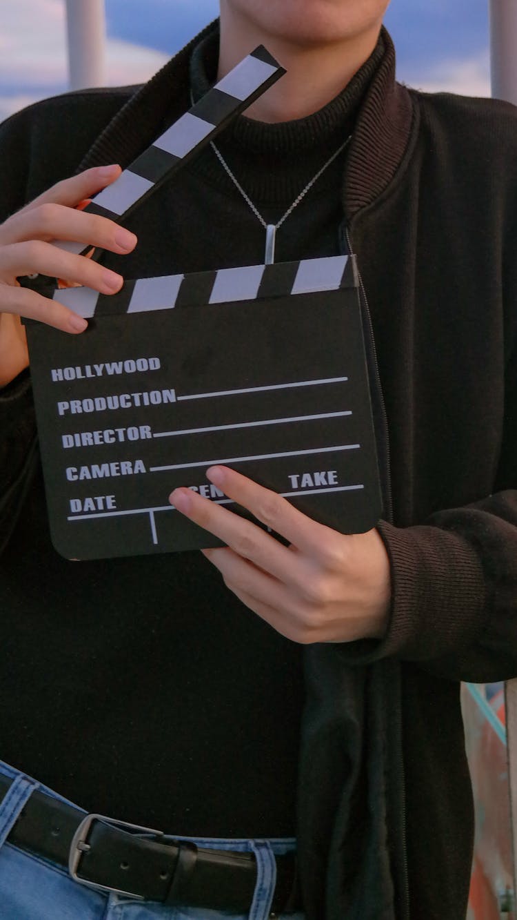 Man Holding A Clapperboard