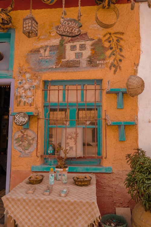 Free Charming outdoor café scene with colorful wall art and decor. Stock Photo
