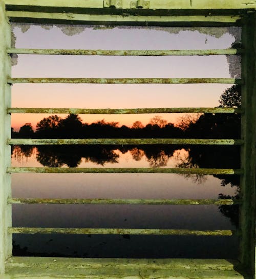 Kostenloses Stock Foto zu abendsonne, am fenster, blick auf den strand