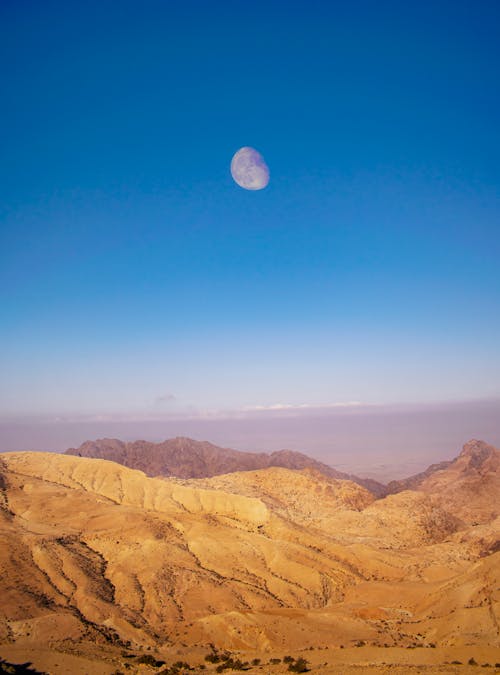 Moon on Clear Sky over Arid Hills