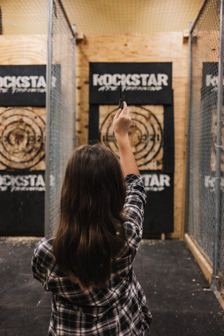 Woman Throwing Star To Target