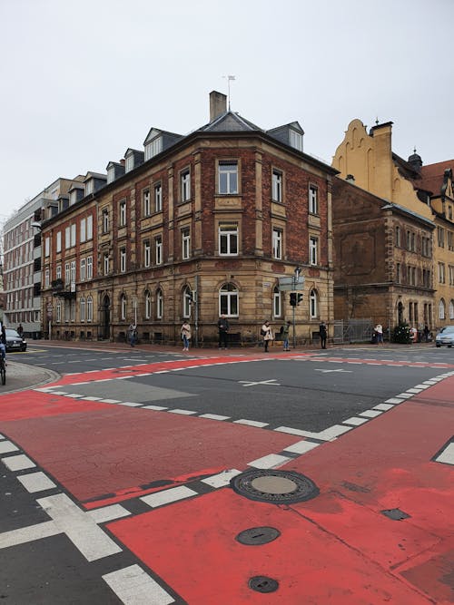 Traditional Tenement House next to an Intersection in City 