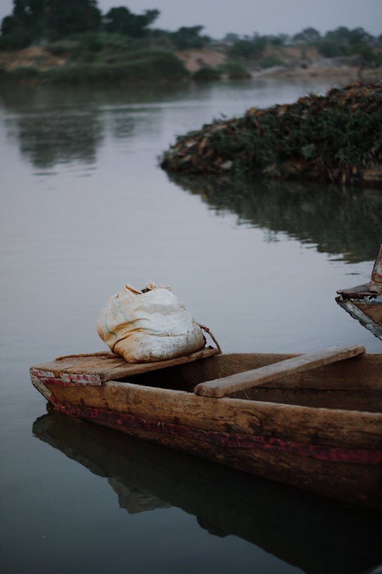 Wooden Boat Moored On River