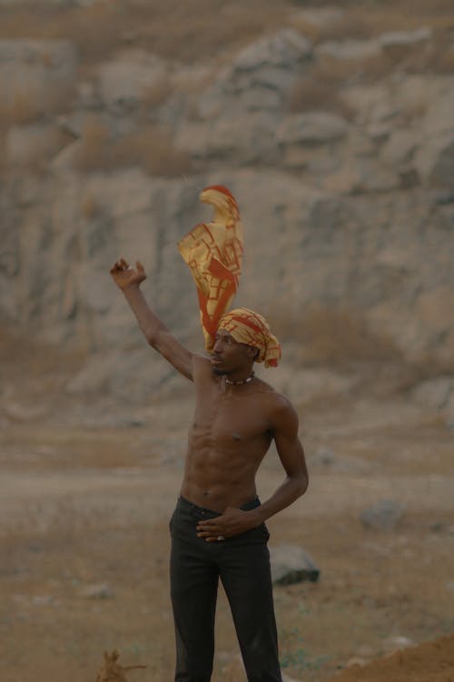 A Shirtless Man with a Headscarf