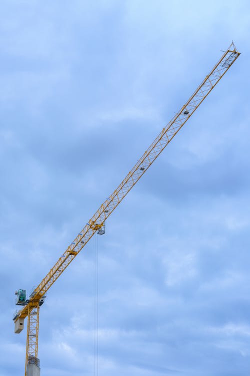 Free Yellow Crane Under the Blue Sky Stock Photo