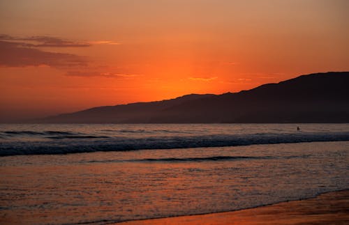 Безкоштовне стокове фото на тему «берег, гора, Захід сонця»