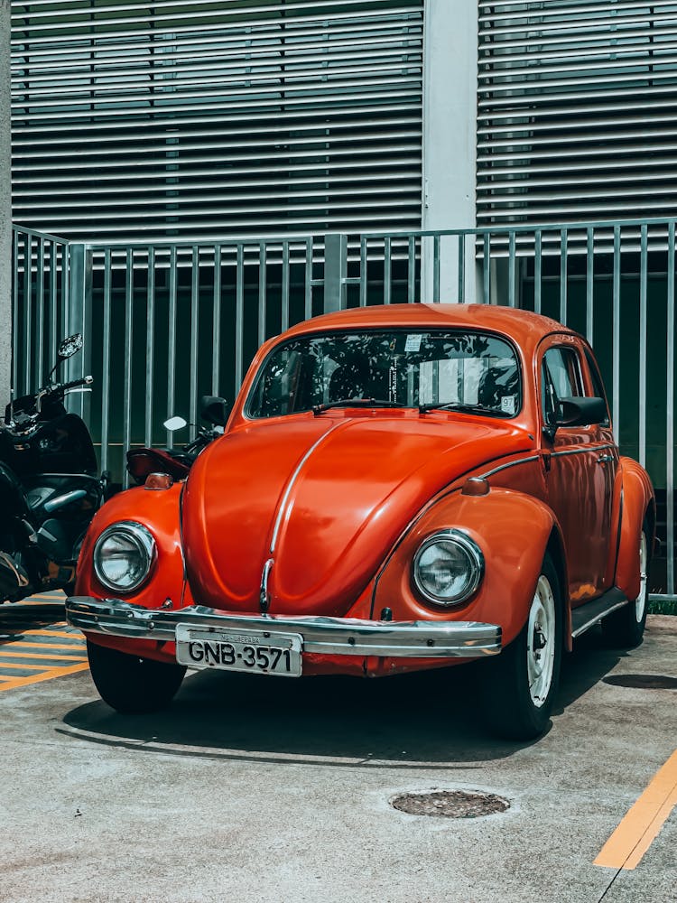 Red Classic Car In A Parking Lot