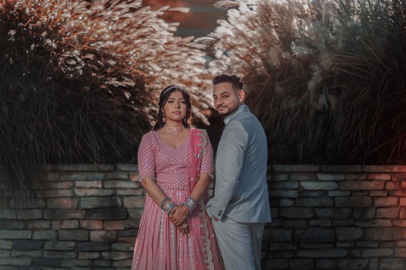 South Asian couple in traditional Indian wedding attire; illustrative stock photograph
